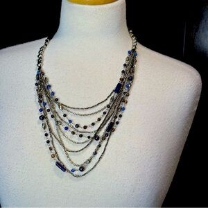 Layered beaded necklace. Silver chain with brown and blue beads